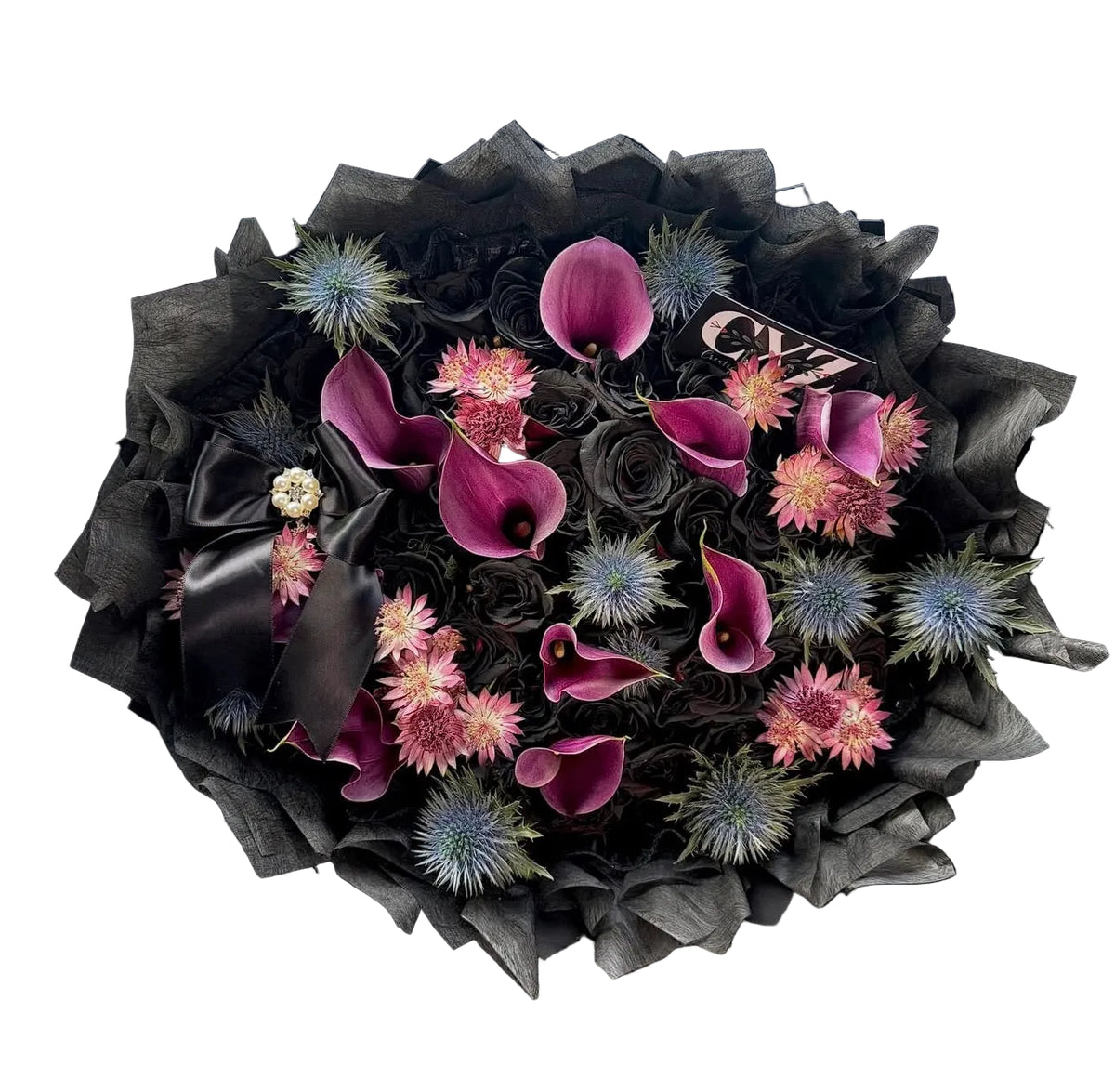 A large 50 black rose count bouquet,  magenta calla lilies, pink chrysanthemums, blue thistle like flowers, and black tissue paper wrapping with a black ribbon.